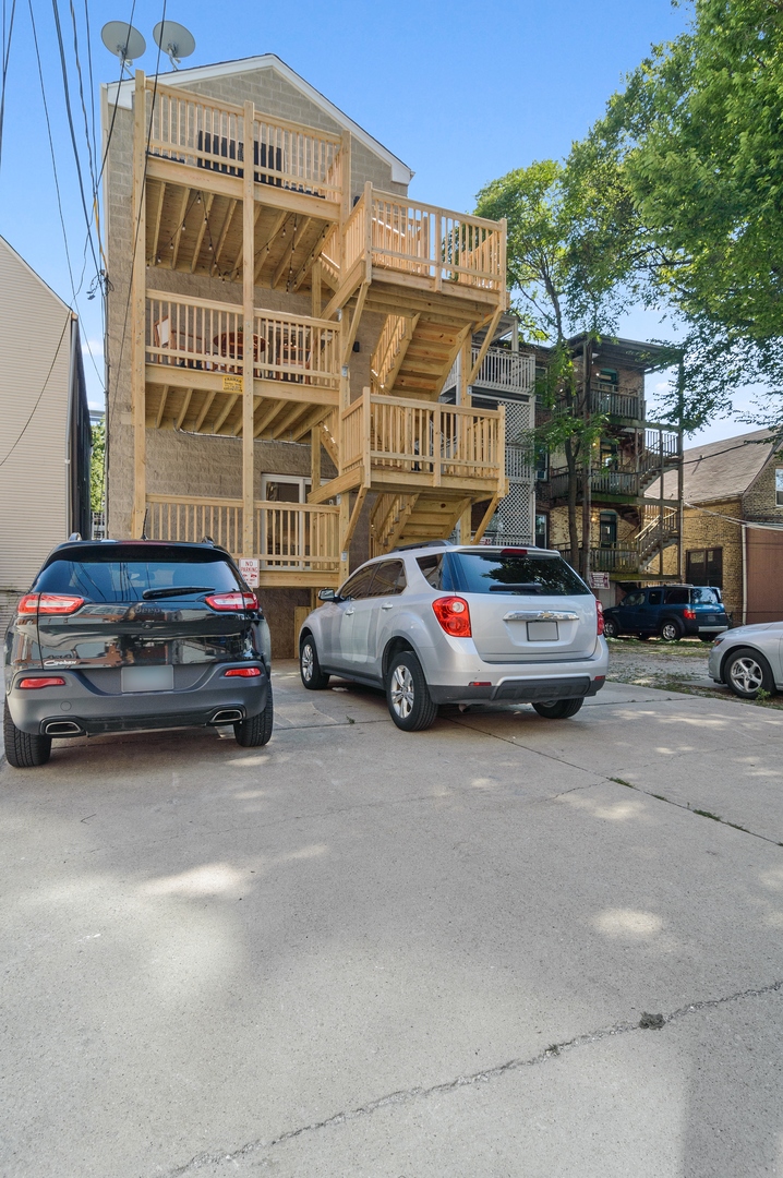 1116 West Addison Street, Unit 2 Chicago, IL 60613 - Photo 16 of 16 a car parked in front of a building