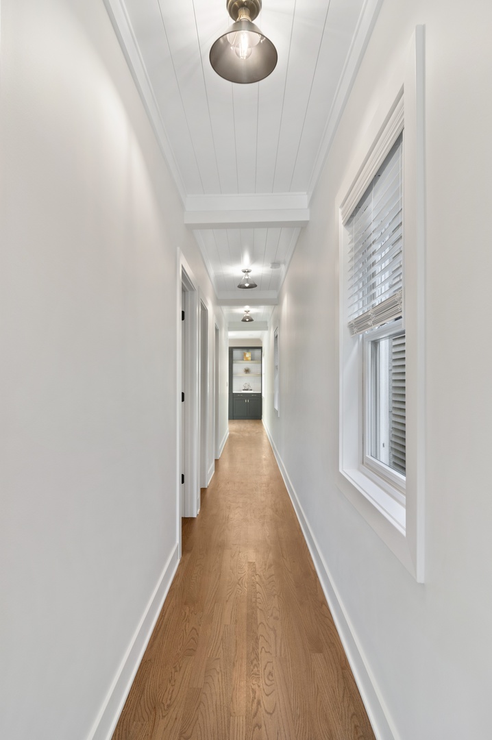 1116 West Addison Street, Unit 2 Chicago, IL 60613 - Photo 5 of 16 wooden floor in an empty room with a window