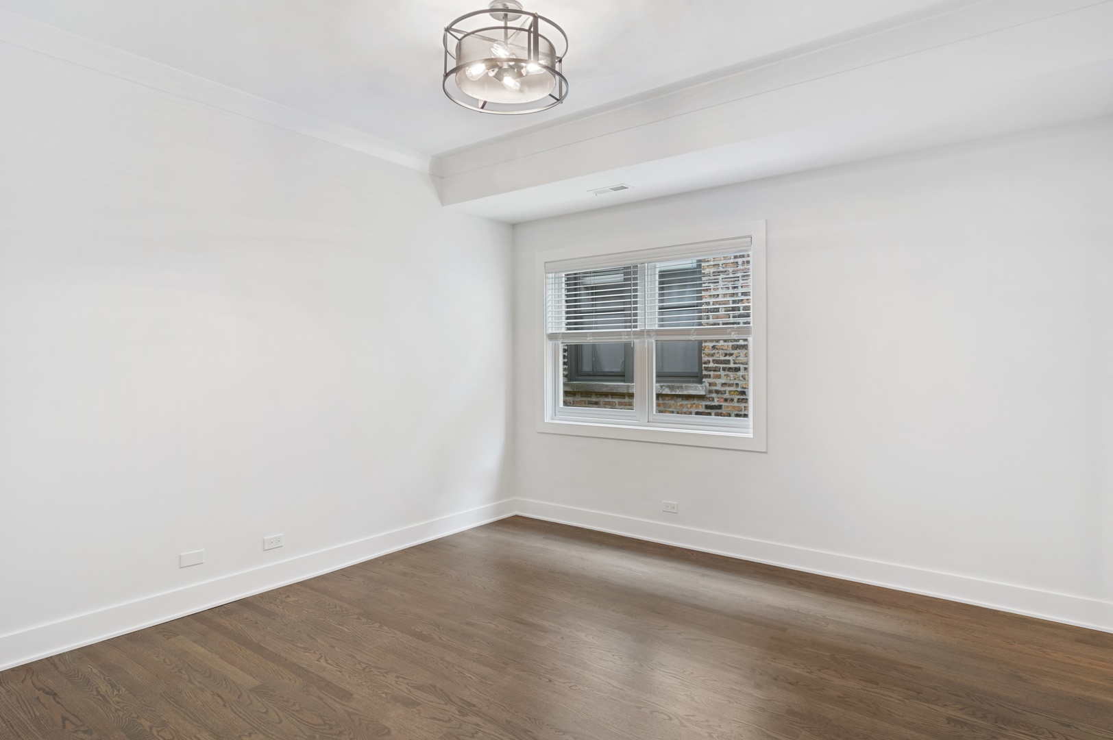 1116 West Addison Street, Unit 2 Chicago, IL 60613 - Photo 10 of 16 an empty room with a window