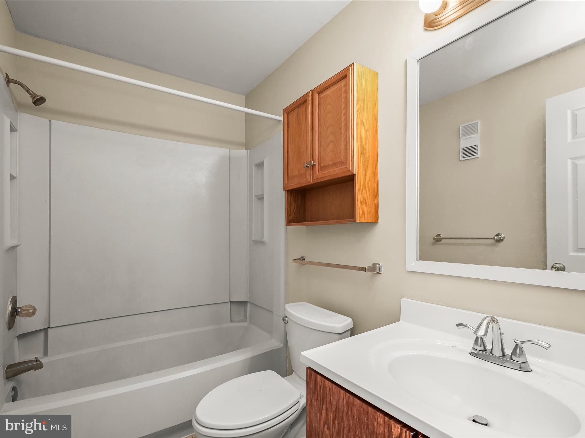 407 South Sharp Street, Unit R 6 Baltimore, MD 21201 - Photo 16 of 20 a bathroom with a sink toilet and shower