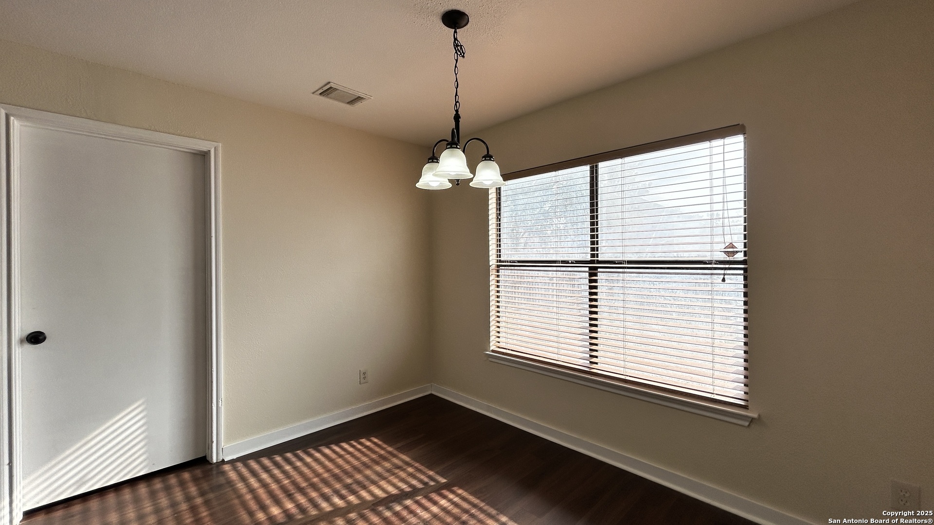 8018 Chestnut Gate Lane Converse, TX 78109 - Photo 14 of 38 a window in an empty room with a window