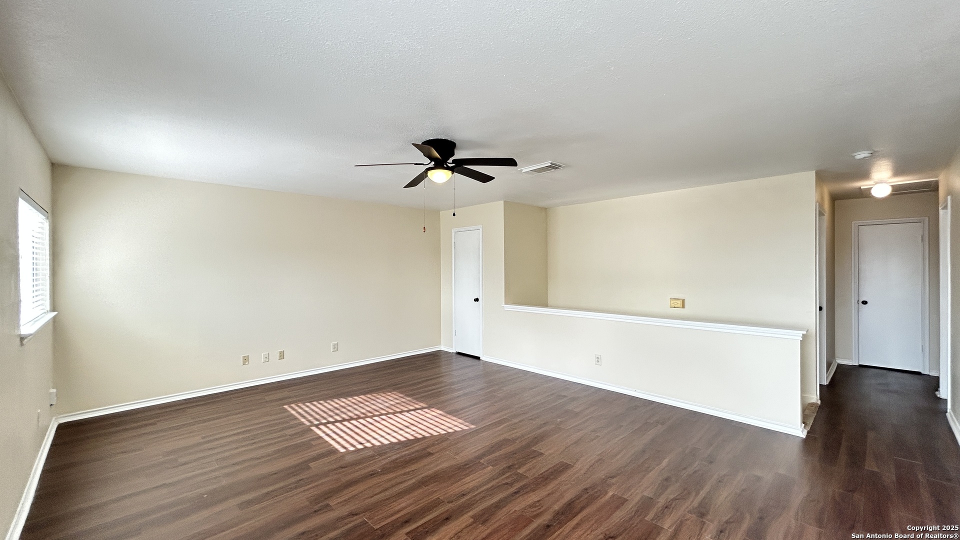 8018 Chestnut Gate Lane Converse, TX 78109 - Photo 17 of 38 wooden floor in an empty room with a window
