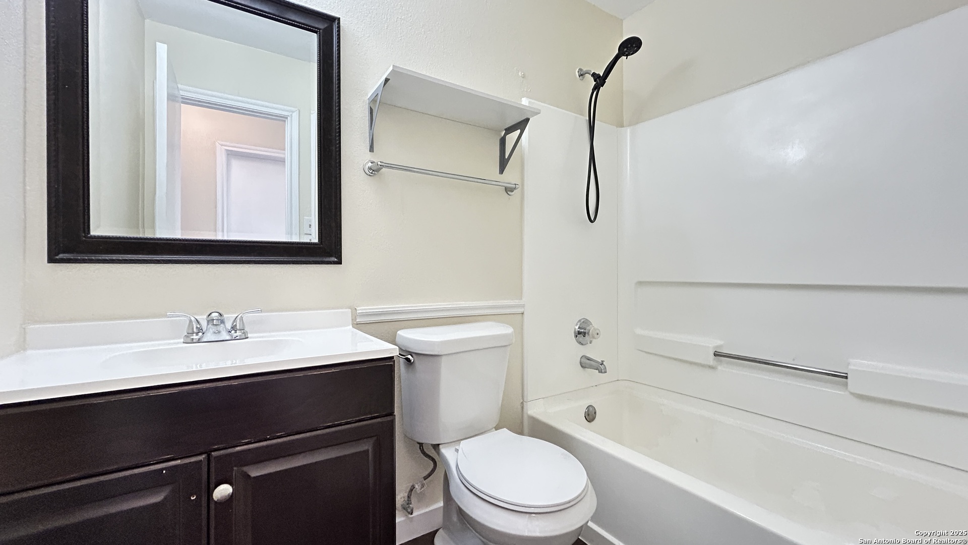 8018 Chestnut Gate Lane Converse, TX 78109 - Photo 23 of 38 a bathroom with a sink a toilet and shower