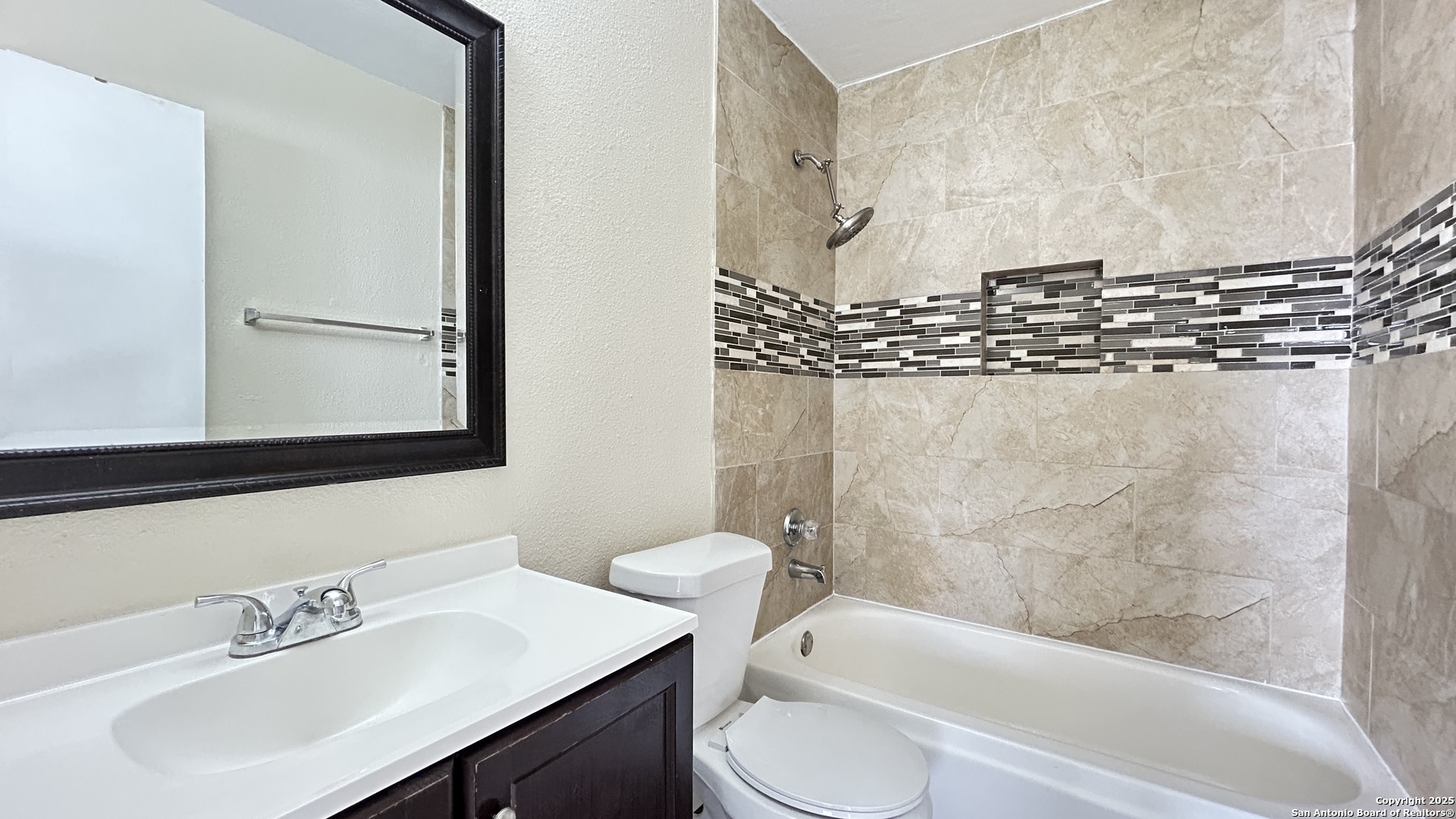 8018 Chestnut Gate Lane Converse, TX 78109 - Photo 31 of 38 a bathroom with a sink toilet and shower