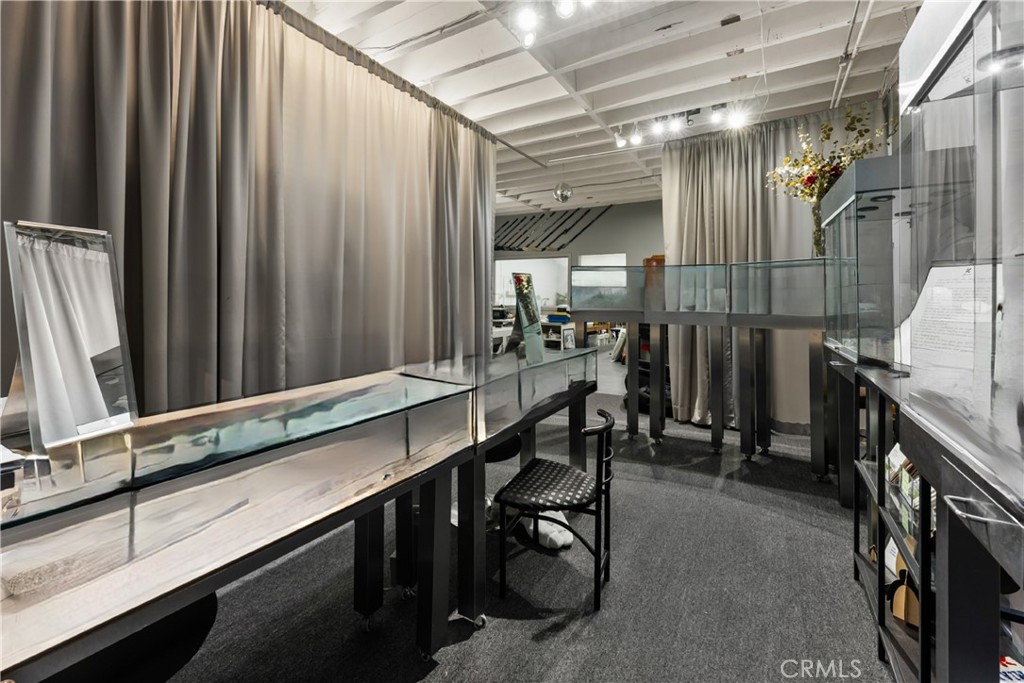 3268 Motor Avenue Los Angeles, CA 90034 - Photo 11 of 22 a room with lots of wooden furniture and a window