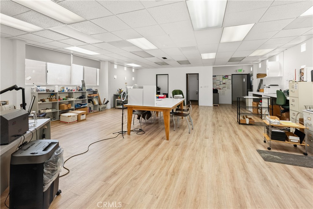 3268 Motor Avenue Los Angeles, CA 90034 - Photo 18 of 22 a living room with lots of furniture and kitchen view