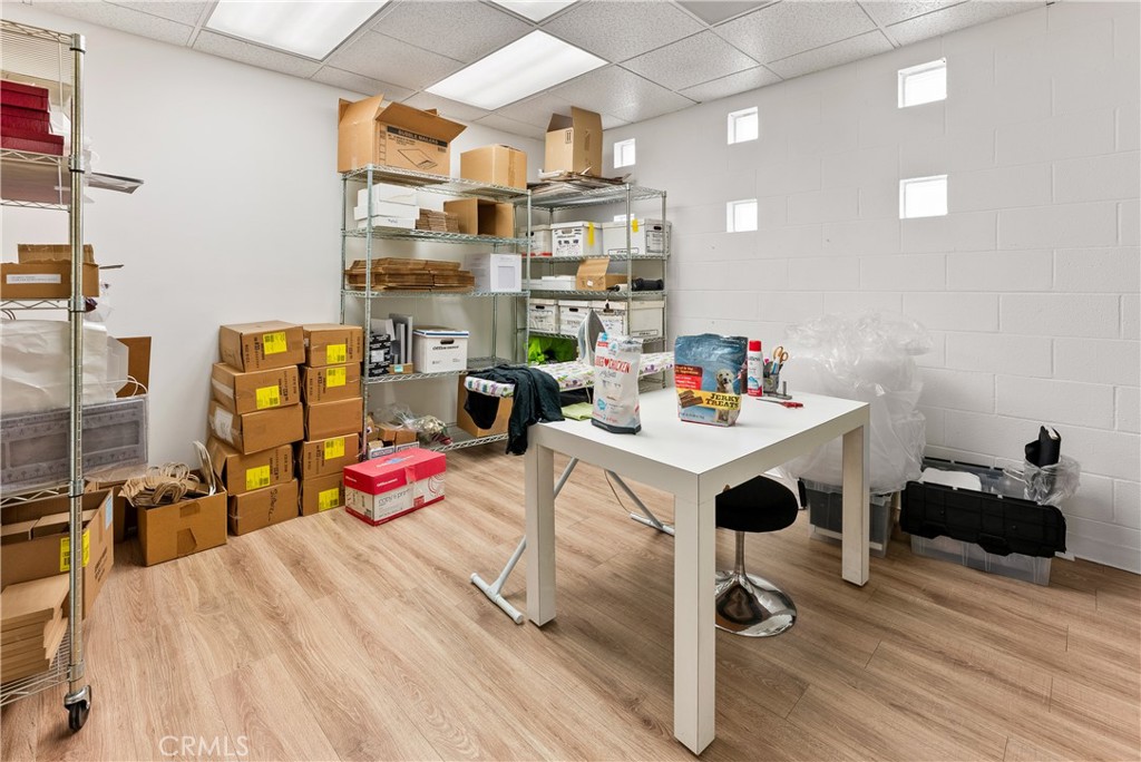 3268 Motor Avenue Los Angeles, CA 90034 - Photo 20 of 22 a bedroom with furniture and a chandelier