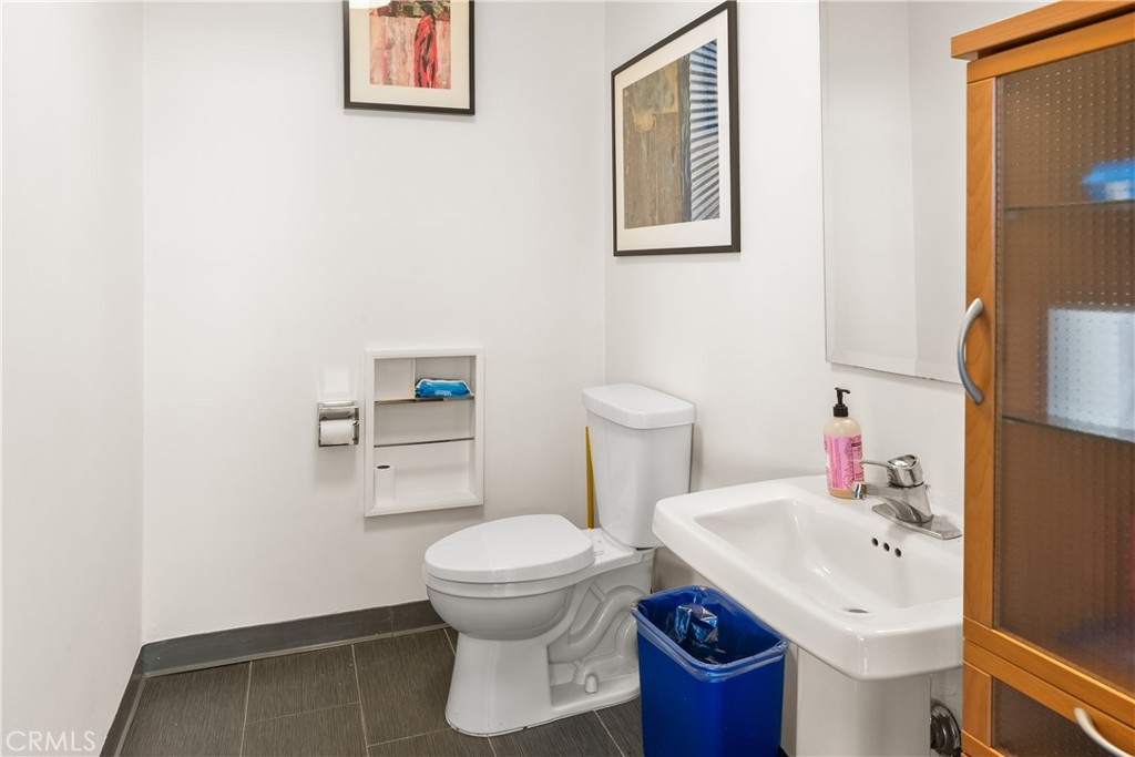 3268 Motor Avenue Los Angeles, CA 90034 - Photo 22 of 22 a bathroom with a toilet sink and mirror