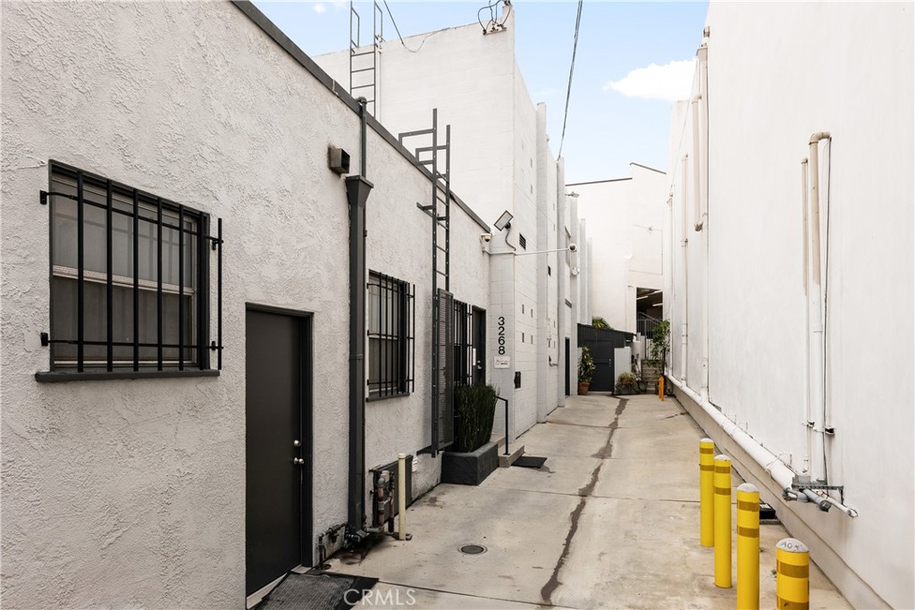 3268 Motor Avenue Los Angeles, CA 90034 - Photo 3 of 22 a view of hallway with stairs and a couch