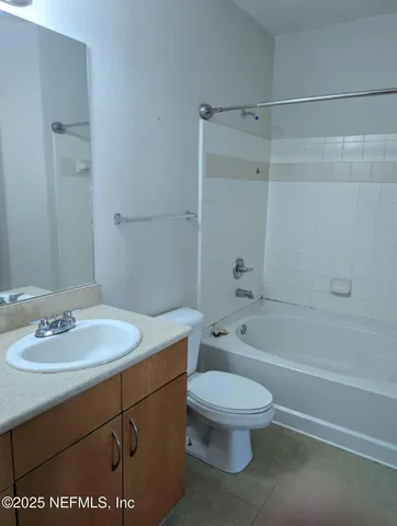 a bathroom with a sink a toilet and a bathtub