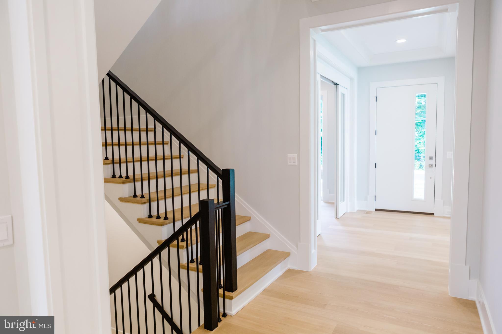 10021 Glenmere Road Fairfax, VA 22032 - Photo 11 of 46 a view of a hallway with wooden floor and staircase