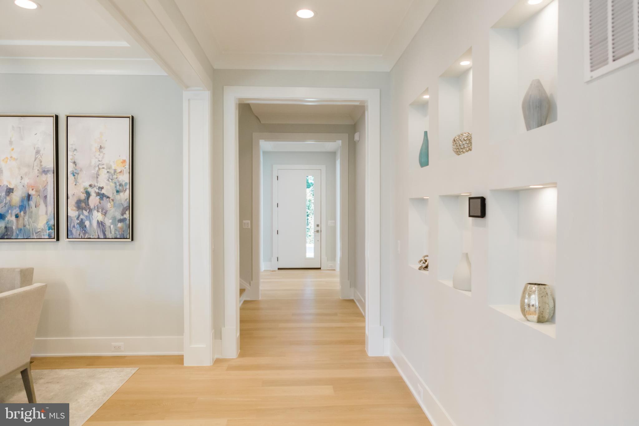 10021 Glenmere Road Fairfax, VA 22032 - Photo 11 of 49 a view of a hallway with wooden floor and entryway