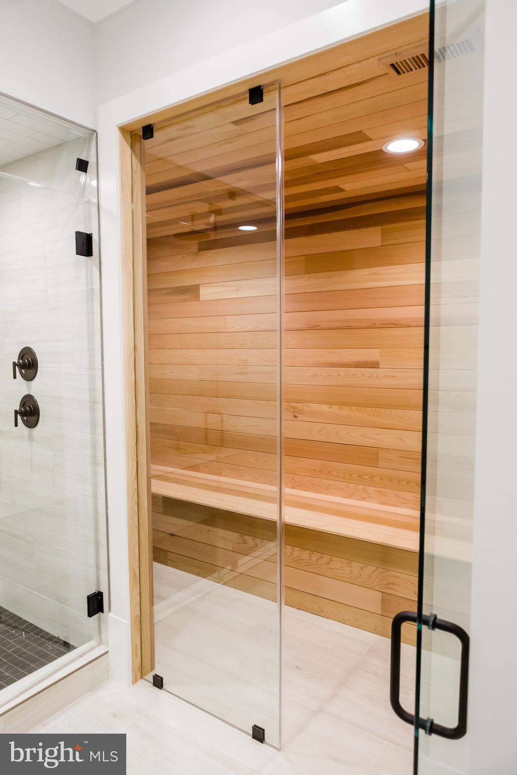 10021 Glenmere Road Fairfax, VA 22032 - Photo 48 of 49 a bathroom with a glass shower door