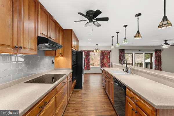 a bathroom with a double vanity sink a mirror and shower