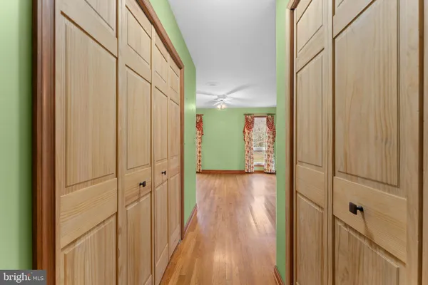 a view of an entryway with wooden floor and chandelier