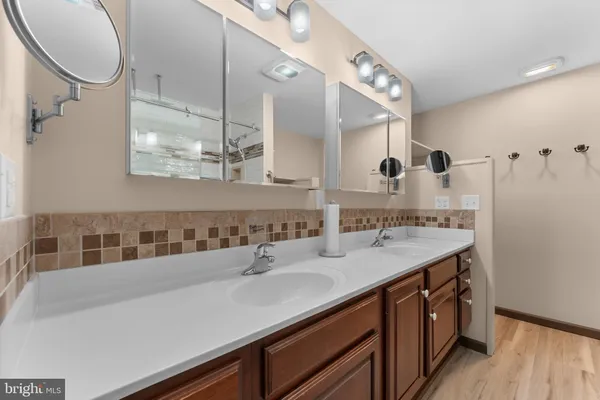 a picture of a bathroom with a shower