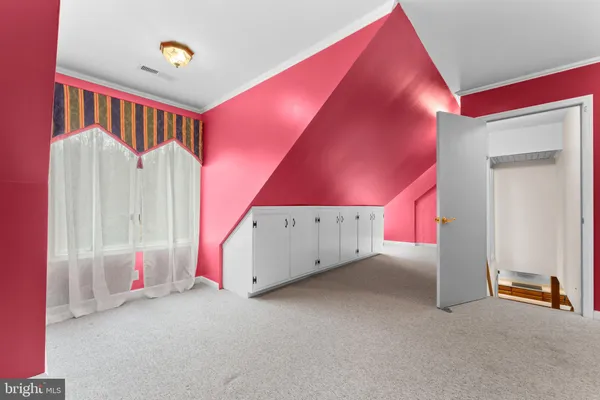 a view of a yard covered with snow in front of house