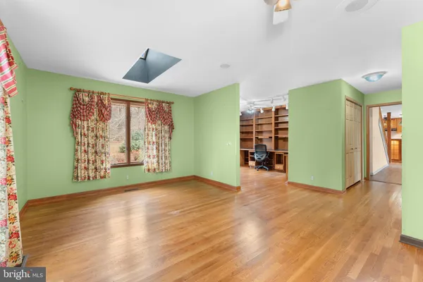 a view of a house with a yard and roof
