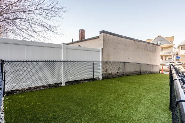 a backyard of a house with lots of green space