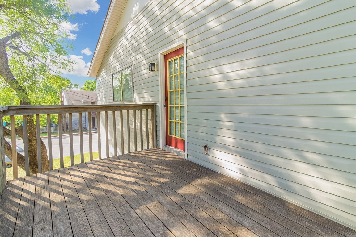 a view of balcony with wooden floor