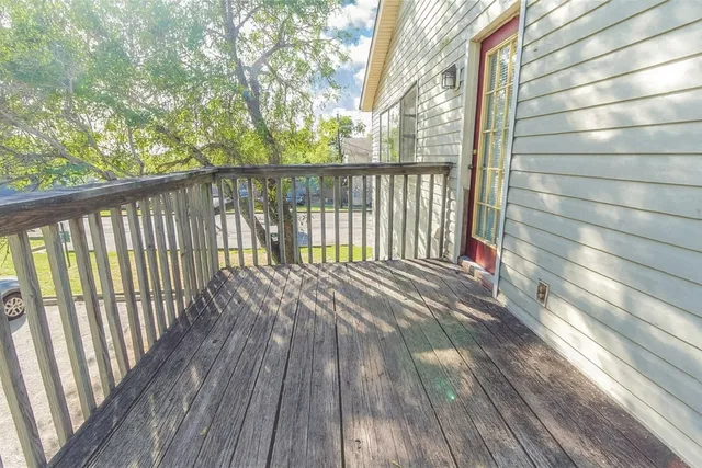 a view of balcony with wooden floor