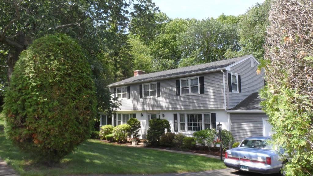 129 Rolling Ridge Road North Haven, CT 06473 - Photo 1 of 1 a front view of a house with a garden and plants
