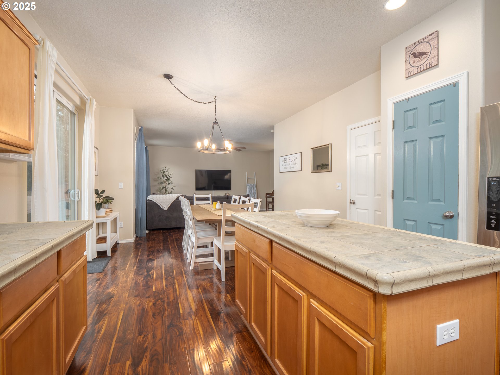 121 Burl Street Newberg, OR 97132 - Photo 15 of 48 a open kitchen with a sink and wooden floor