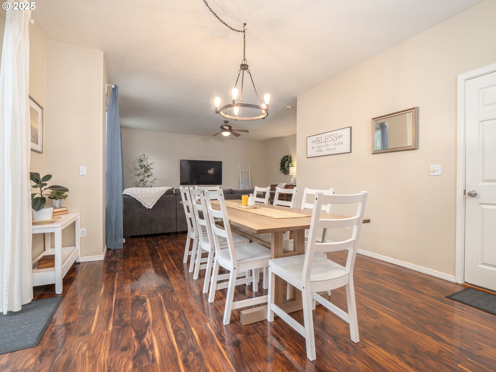 121 Burl Street Newberg, OR 97132 - Photo 16 of 48 a view of a dining room with furniture wooden floor and chandelier