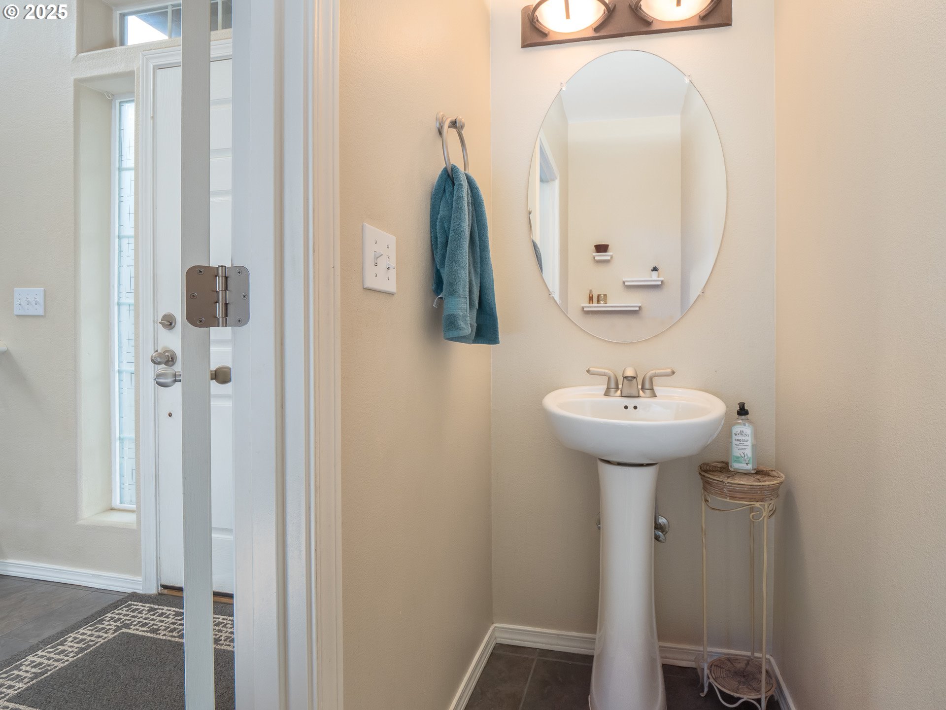 121 Burl Street Newberg, OR 97132 - Photo 17 of 48 a bathroom with a sink and mirror