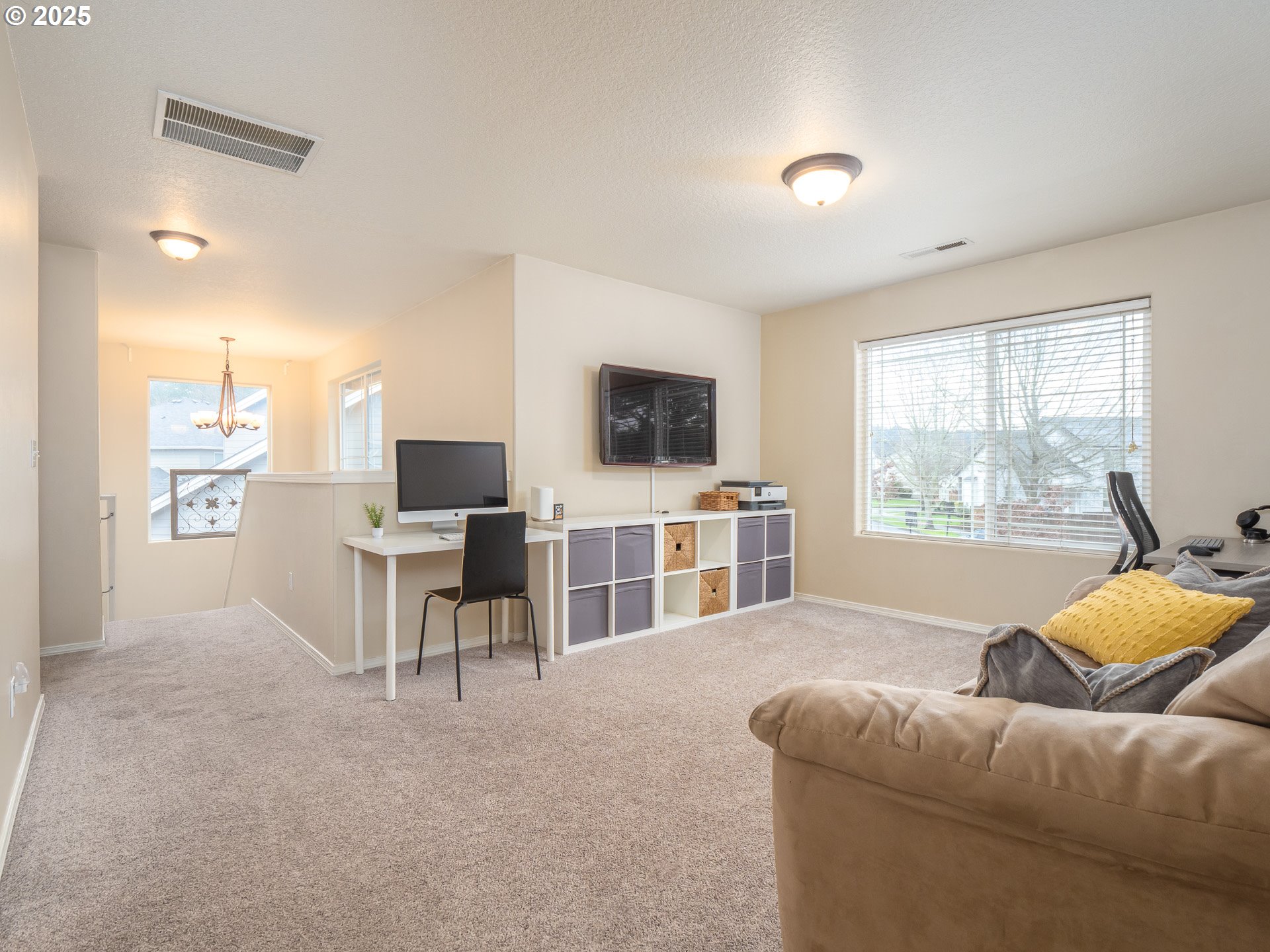 121 Burl Street Newberg, OR 97132 - Photo 19 of 48 a living room with furniture and a flat screen tv