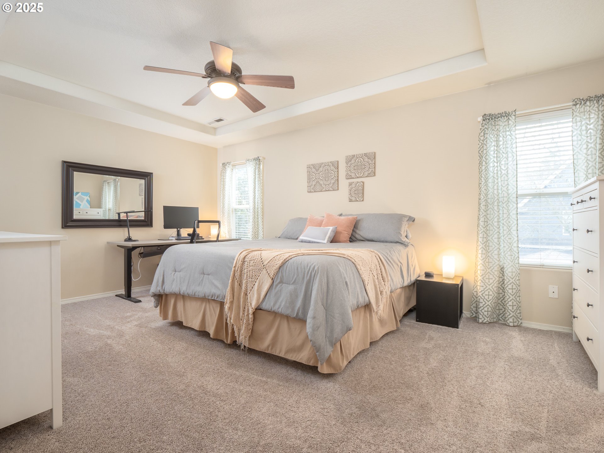 121 Burl Street Newberg, OR 97132 - Photo 21 of 48 a spacious bedroom with a bed and a chandelier