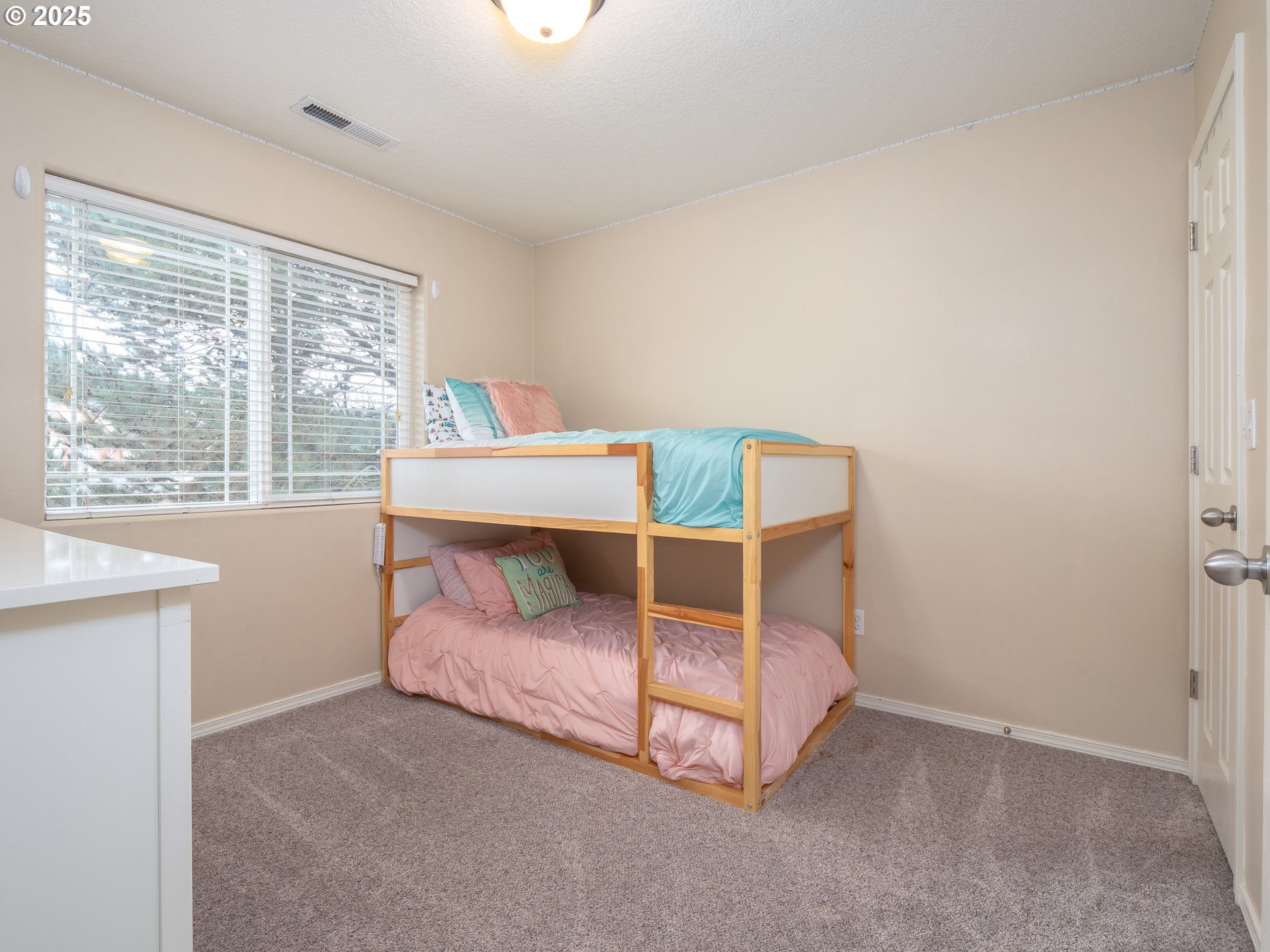 121 Burl Street Newberg, OR 97132 - Photo 25 of 48 a bed sitting in a bedroom next to a window