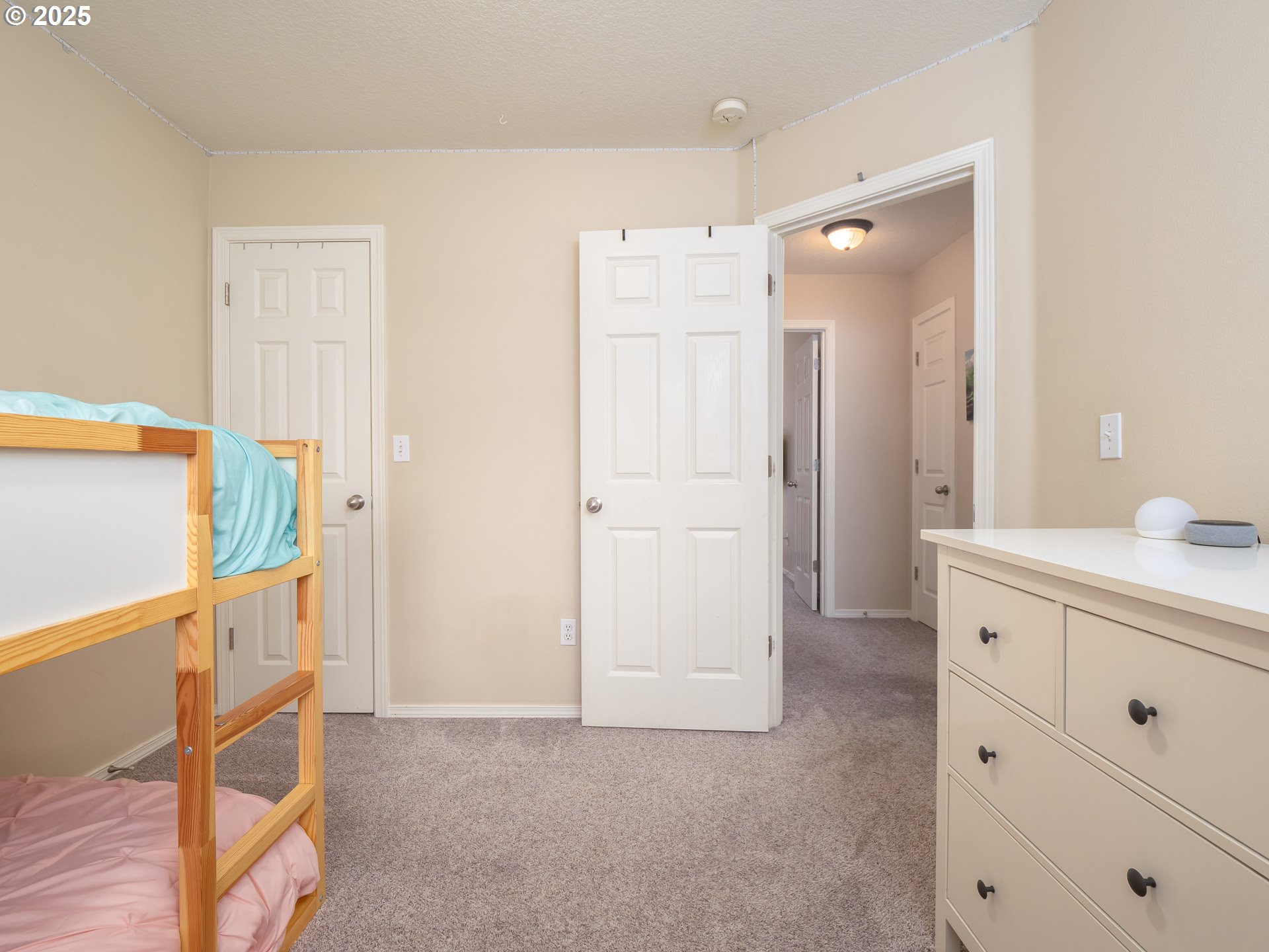 121 Burl Street Newberg, OR 97132 - Photo 26 of 48 a view of a hallway with closet and wooden floor