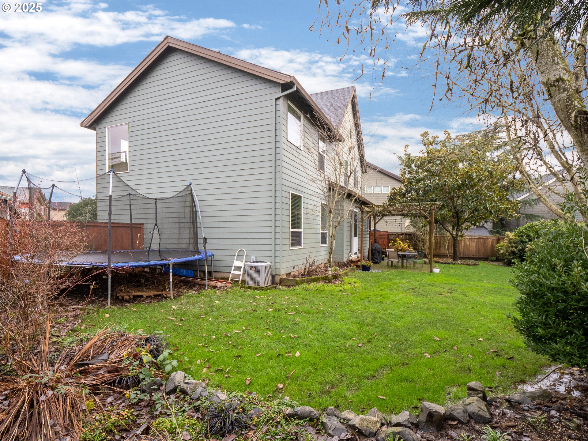 121 Burl Street Newberg, OR 97132 - Photo 35 of 48 a backyard of a house with table and chairs