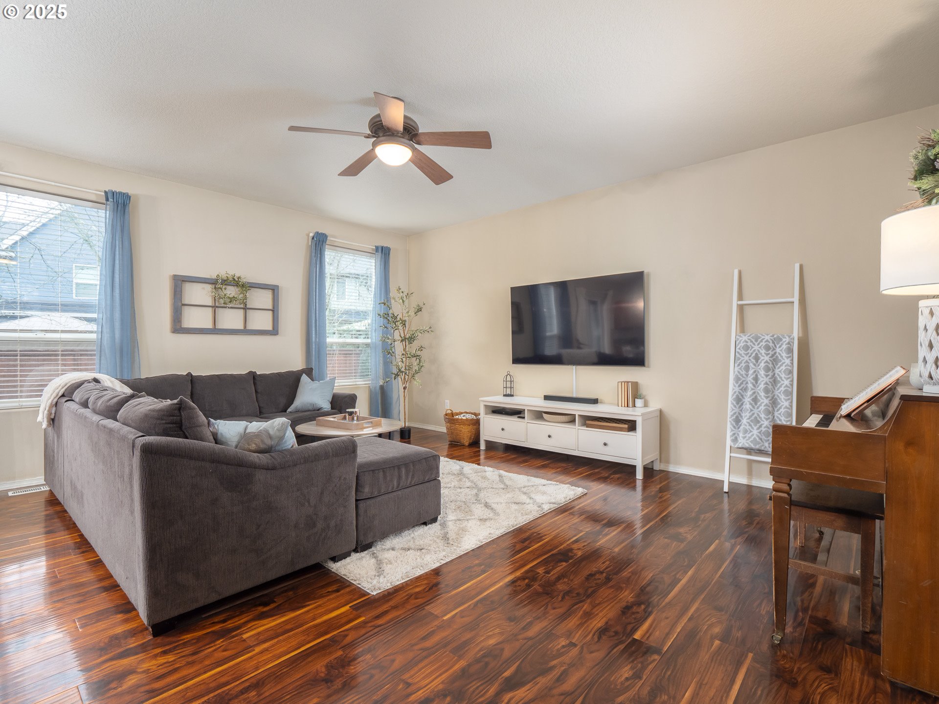 121 Burl Street Newberg, OR 97132 - Photo 5 of 48 a living room with furniture and a flat screen tv