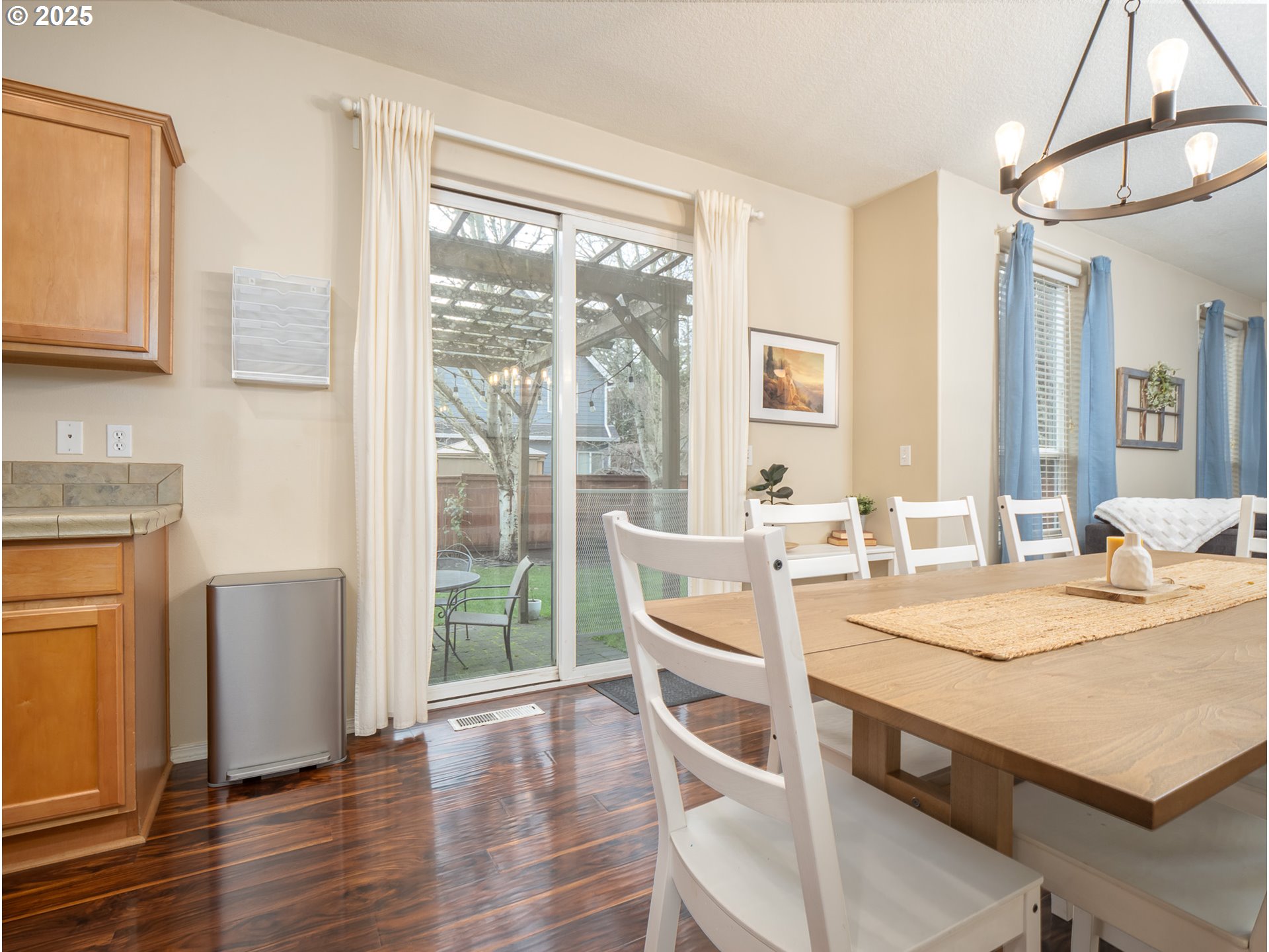 121 Burl Street Newberg, OR 97132 - Photo 8 of 48 a view of a dining room with furniture window and wooden floor