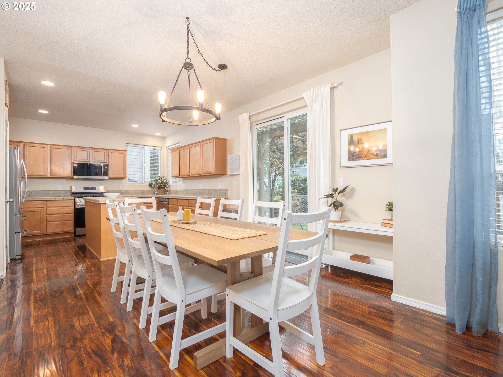 121 Burl Street Newberg, OR 97132 - Photo 10 of 48 a view of a dining room with furniture window and wooden floor