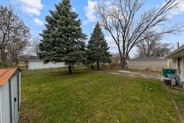 a view of backyard with green space