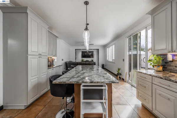 a kitchen with a table and chairs in it
