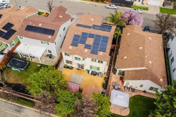 an aerial view of residential houses with outdoor space