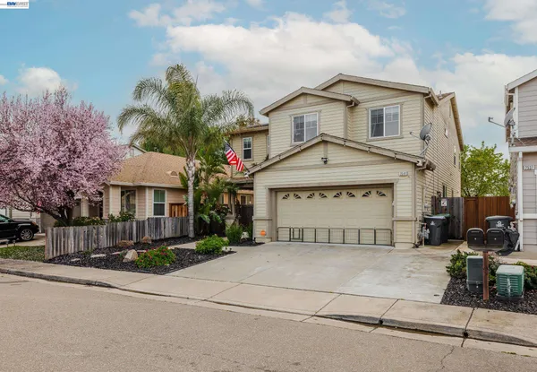 a view of a house with potted plants