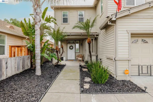 a kitchen with furniture and wooden floors