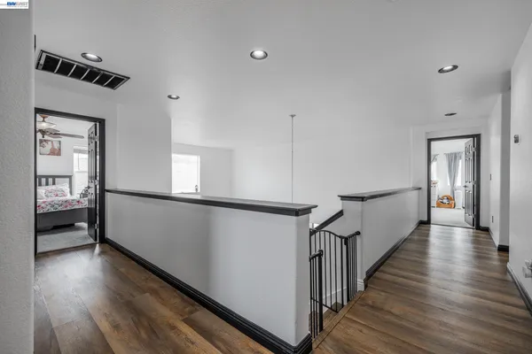 a bedroom with bed and a couch