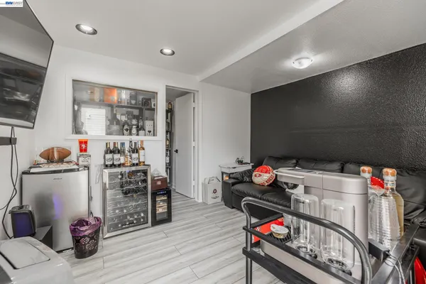 a room with furniture and white walls