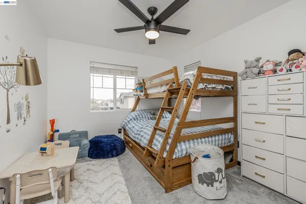 a bed room with a bed and a window