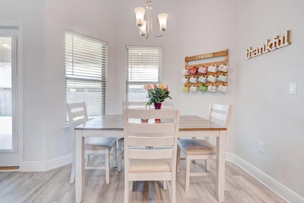 a white table with chairs and a table