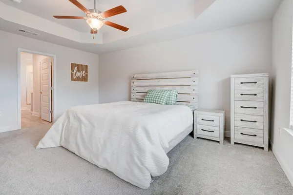 a bedroom with a bed and closet