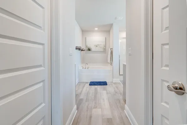 a bathroom with a glass shower door