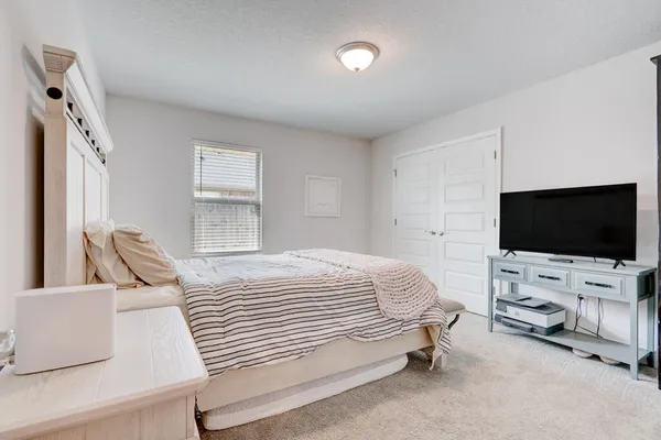 a bathroom with a sink a toilet a shower and a mirror