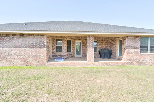 a view of garage and yard